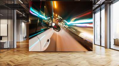 Car driving in city at night, blur motion Wall mural