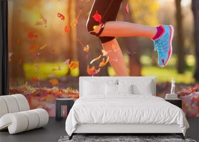 Close up of feet of a runner running in leaves Wall mural