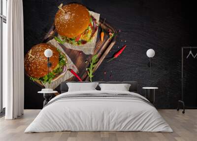 Delicious hamburgers, served on stone. Wall mural