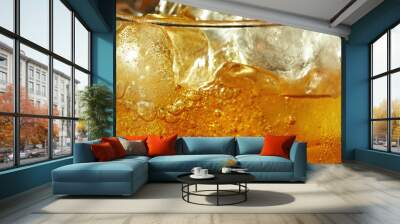 Detail of cider with ice cubes in glass. Wall mural