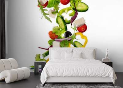 Flying vegetable greek salad isolated on white background Wall mural