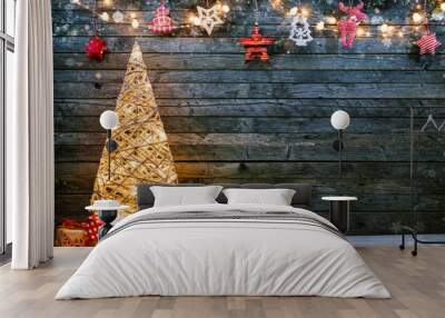 Holidays background with illuminated Christmas tree, gifts and decoration. Wall mural