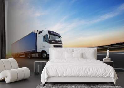 Loaded European truck on motorway in sunset Wall mural