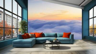 Panoramic view above clouds with beautiful sunset. Wall mural