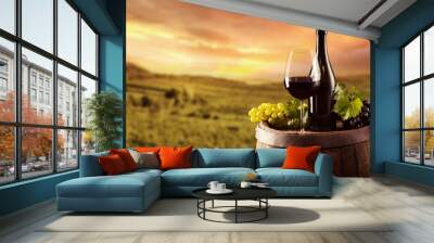 Red wine bottle and glass on wodden keg Wall mural