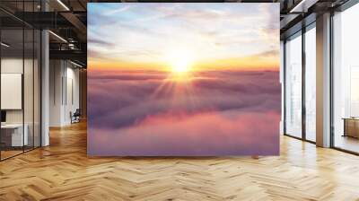 Rising sunset above the clouds Wall mural