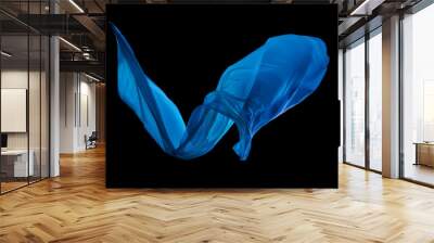 Smooth elegant blue cloth on black background Wall mural