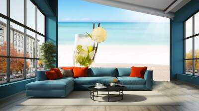 Summer mojito drink with blur beach on background Wall mural