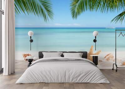 Summer sandy beach with blur ocean on background Wall mural