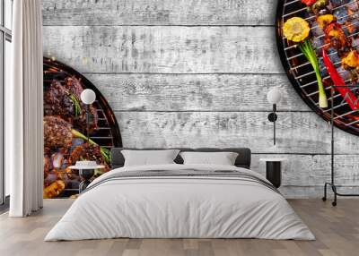 top view of fresh meat and vegetable on grill placed on wood Wall mural