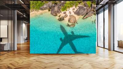 Travel concept with airplane shadow and beach Wall mural