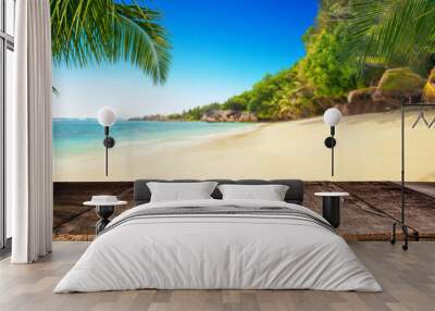 Tropical beach with wooden table, summer holiday background. Wall mural