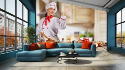 Young chef woman cooker ready for food preparation Wall mural