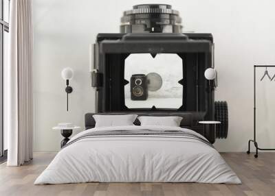 The old medium format film TLR camera, camera for modern lomography on white cement background. Wall mural