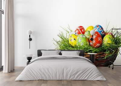 Easter basket filled with hand painted pastel Easter Eggs isolated on white background. Wall mural