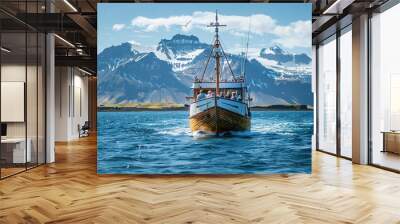 fishing boat waiting to depart in the east fjords of iceland in front of snow capped mountains Wall mural