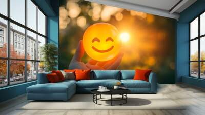 Hand holding a yellow happy face in white background with copy space. Positive customer feedback and review, good service concept. Wall mural