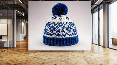 knitted blue white hat isolated on white background.hat with pompon. Wall mural