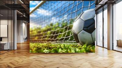 Football on Green Grass, Sporting Game in Action, Soccer Field with Goal and Stadium Background Wall mural