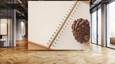 Blank paper notebook with pine cone.Autumn lifestyle concept,Vintage tone. Wall mural