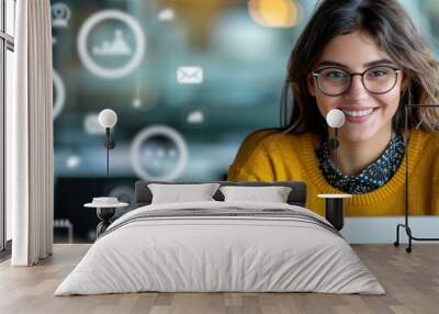 A young woman using a laptop with floating social media icons in a modern office. Wall mural