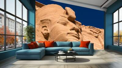 Abu Simbel, Egypt: Exterior view of the majestic statues of Ramses II that ornate the facade of the famous Abu Simbel temple in Upper Egypt. Wall mural