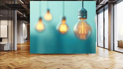 Hanging light bulbs illuminating a blue-toned background. Wall mural