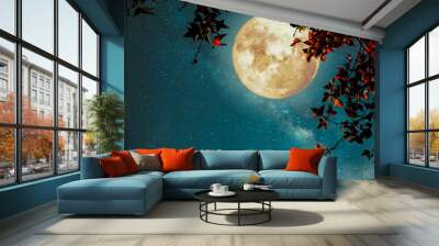 Beautiful autumn fantasy - maple tree in fall season and full moon with milky way star in night skies background. Retro style artwork with vintage color tone Wall mural