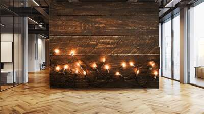 christmas lights bulb on wood table. merry christmas (xmas) background. topview, border design - rus Wall mural