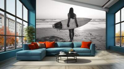 Nostalgia and remembrance photo of surfer woman in bikini go to surfing. beautiful sexy woman with surfboard on beach. black and white color tone. Wall mural