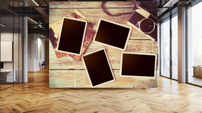 retro camera and empty old instant paper photo album on wood table - blank photo frame vintage style Wall mural