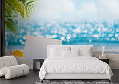 Sandy beach with empty paper card for message design. blur sea on background. Tranquil beach scene for travel inspirational. Summer exotic holiday and vacation concept for tourism relaxing. Wall mural