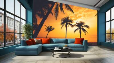 Silhouette of tropical beach during sunset twilight. seascape of summer beach and palm tree at sunset. vintage color tone Wall mural