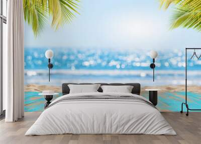 Top of wood table with seascape and palm leaves, blur bokeh light of calm sea and sky at tropical beach background. Empty ready for your product display montage.  summer vacation background concept. Wall mural