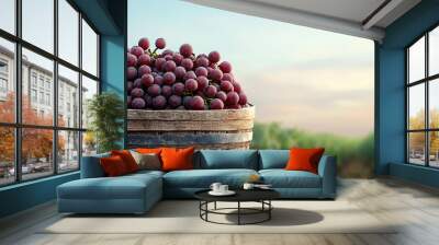 Bountiful harvest a stunning display of fresh grapes in a rustic barrel amidst lush vineyard scenery Wall mural