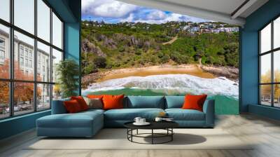 Aerial, drone view of the spectacular Sunshine Coast city near Brisbane. Beautiful buildings on the cliffs and golden sand second bay Coolum. Landscape of Queensland, Australia Wall mural