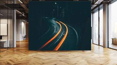 Vertical shot of orange light trails on a night road Wall mural