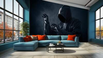 Scary figure in hooded cloak Wall mural