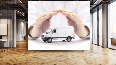 Transport white van car protected by hands Wall mural