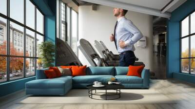 businessman exercising in gym Wall mural