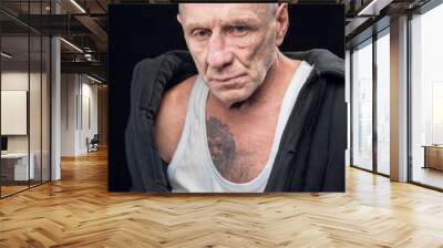 Portrait of a prisoner criminal on a black background Wall mural