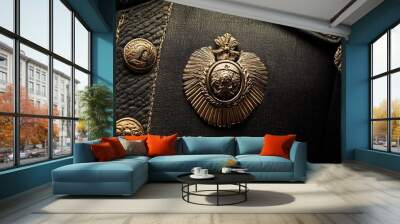 Ornate gold insignia on black fabric. Wall mural