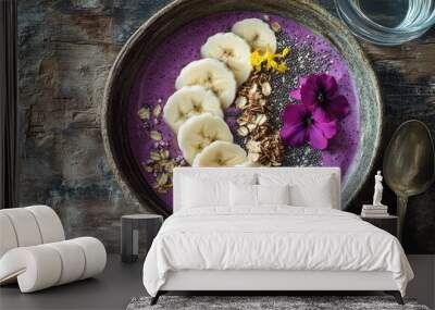 Purple smoothie bowl with banana, granola, and flowers. Wall mural