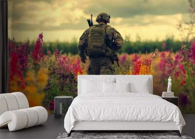 Soldier walking through a field of flowers. Wall mural