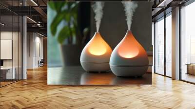 Two essential oil diffusers on a table. Wall mural