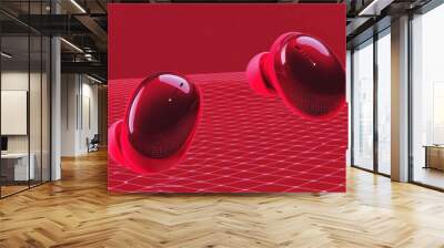 Two red wireless earbuds on red mesh background. Wall mural