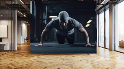 Young athletic man doing push-ups in gym Wall mural