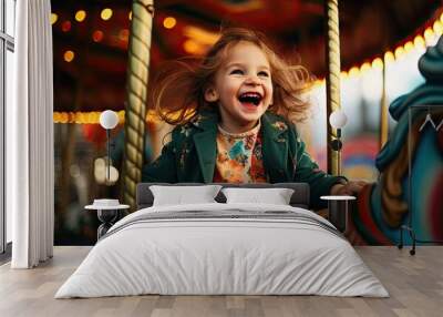 Young girl having fun on children's playground carousel Wall mural