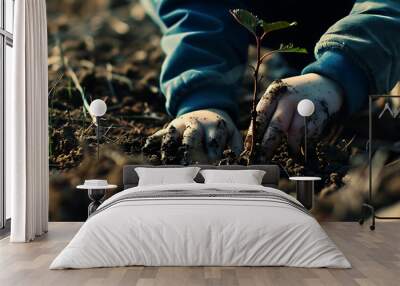 Boy planting a tree in the dirt, in the style of bokeh panorama Wall mural