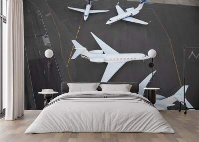 Private jet planes waiting on runway Wall mural